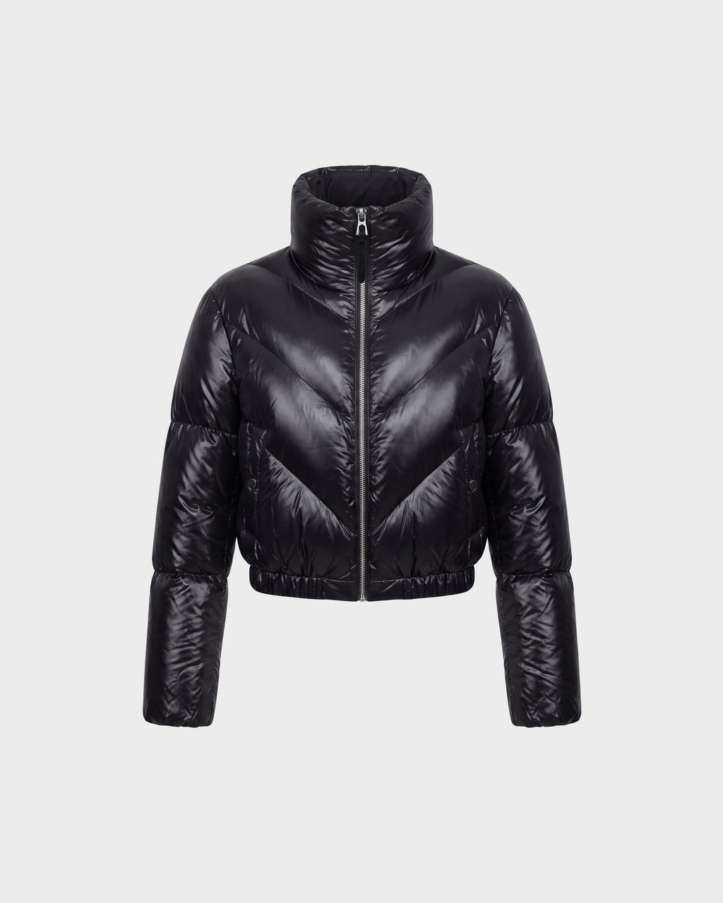 The Rudsak ANSLIE C - 8126713 Black women’s down puffer jacket features a shiny black, cropped silhouette with a high collar and full-length sleeves, displayed on a plain light grey background. Filled with RDS-certified down for exceptional warmth and comfort, this fashion-forward piece is designed with a front zipper closure and horizontal quilted sections.