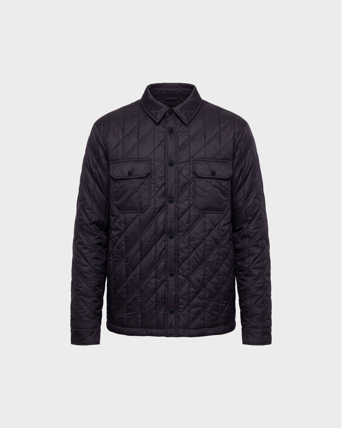 GRIFFIN - 6126758 Black quilted jacket by Rudsak, featuring a button-up front, two chest flap pockets, and a collar, displayed on a plain light gray background.