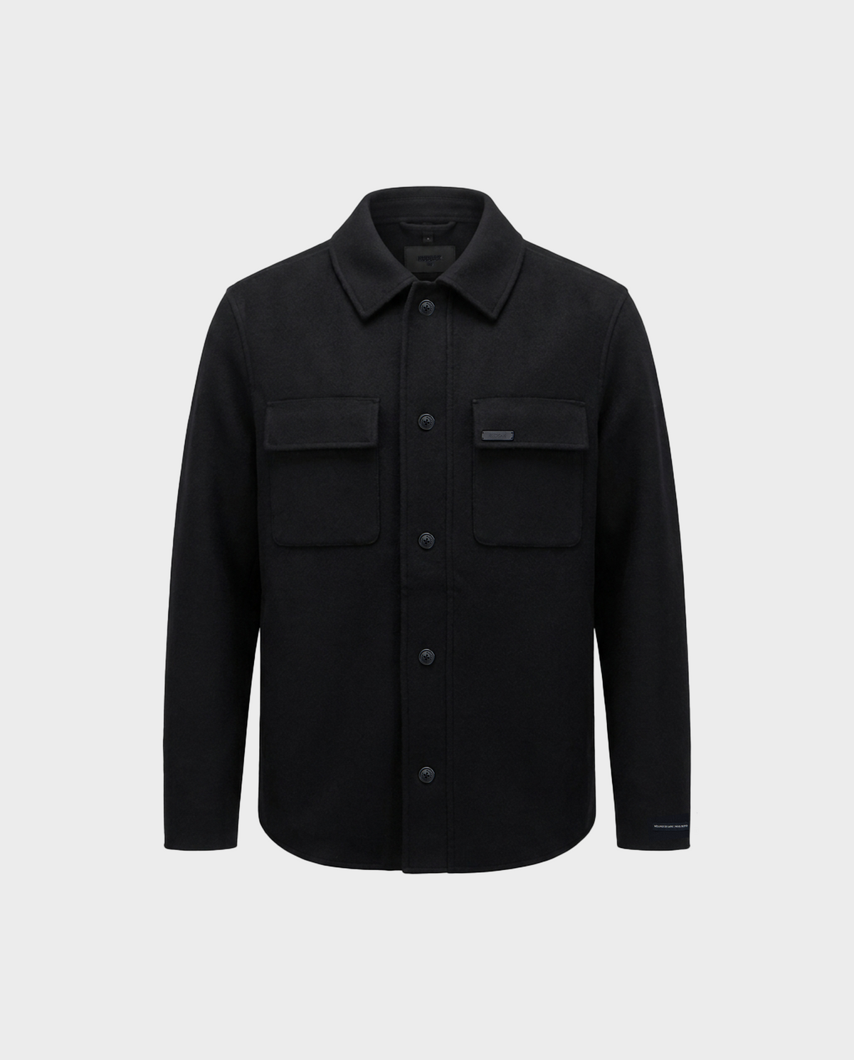 The Rudsak MACKENZIE - 6126715 Black wool blend shirt jacket features a classic collar, long sleeves, and two chest flap pockets, shown against a plain light gray background—making it the perfect men’s shirt jacket for transitional layering.