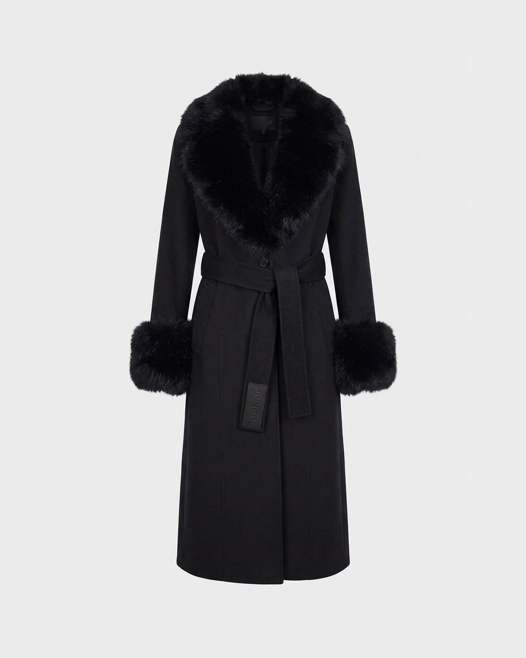 The MARILLA WL - 8126737 Black coat by Rudsak is a long black wool piece featuring a wide faux fur collar and matching fur cuffs. This tailored outerwear includes a tie belt at the waist and showcases a smooth, elegant silhouette, presented against a plain light background.