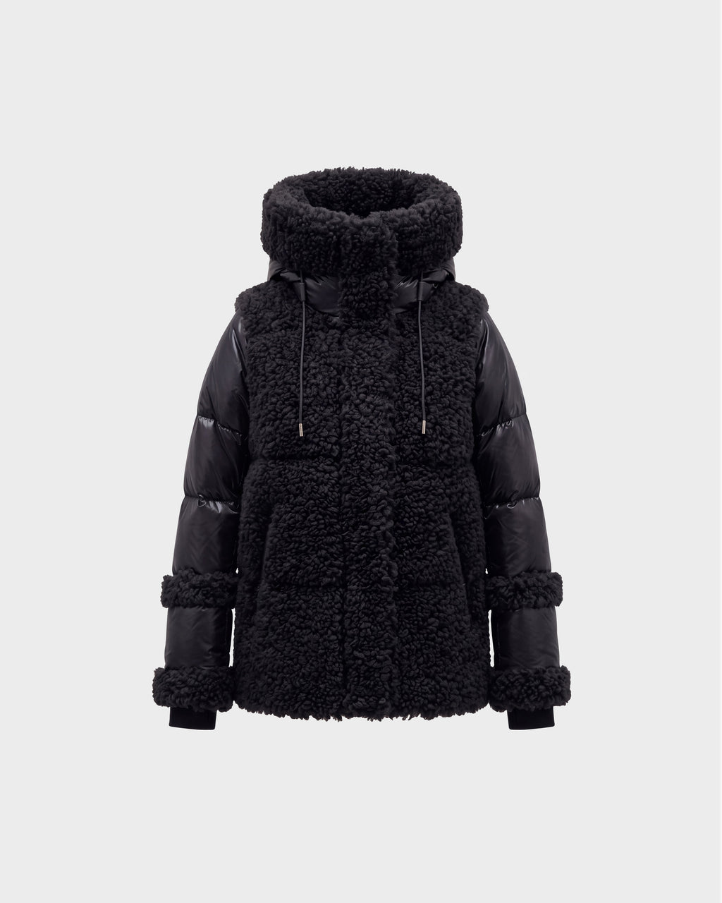 The MARISSA - 8126728 Black by Rudsak is a stylish winter jacket featuring a high, padded collar, shearling-textured body, and smooth quilted sleeves. This sherpa coat includes drawstrings at the collar and boasts chunky, textured details on both the body and sleeves—making it an ideal piece of winter outerwear.