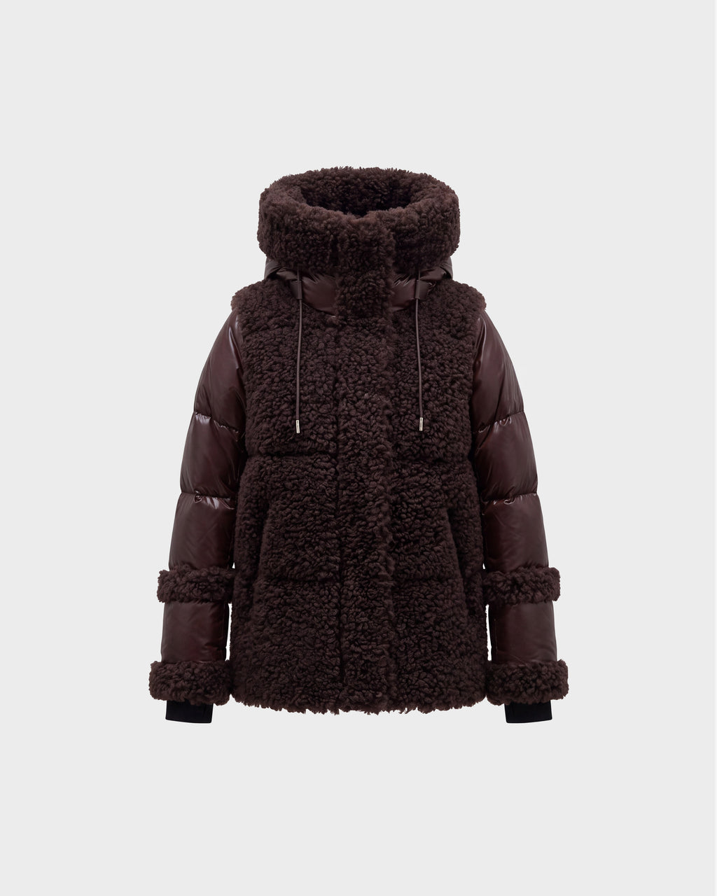 A women’s winter jacket, the MARISSA - 8126728 Espresso by Rudsak, in dark brown features a plush sherpa-textured body paired with smooth, quilted down sleeves. The design includes a high collar, drawstrings, and large front pockets. It is photographed against a plain light gray background.
