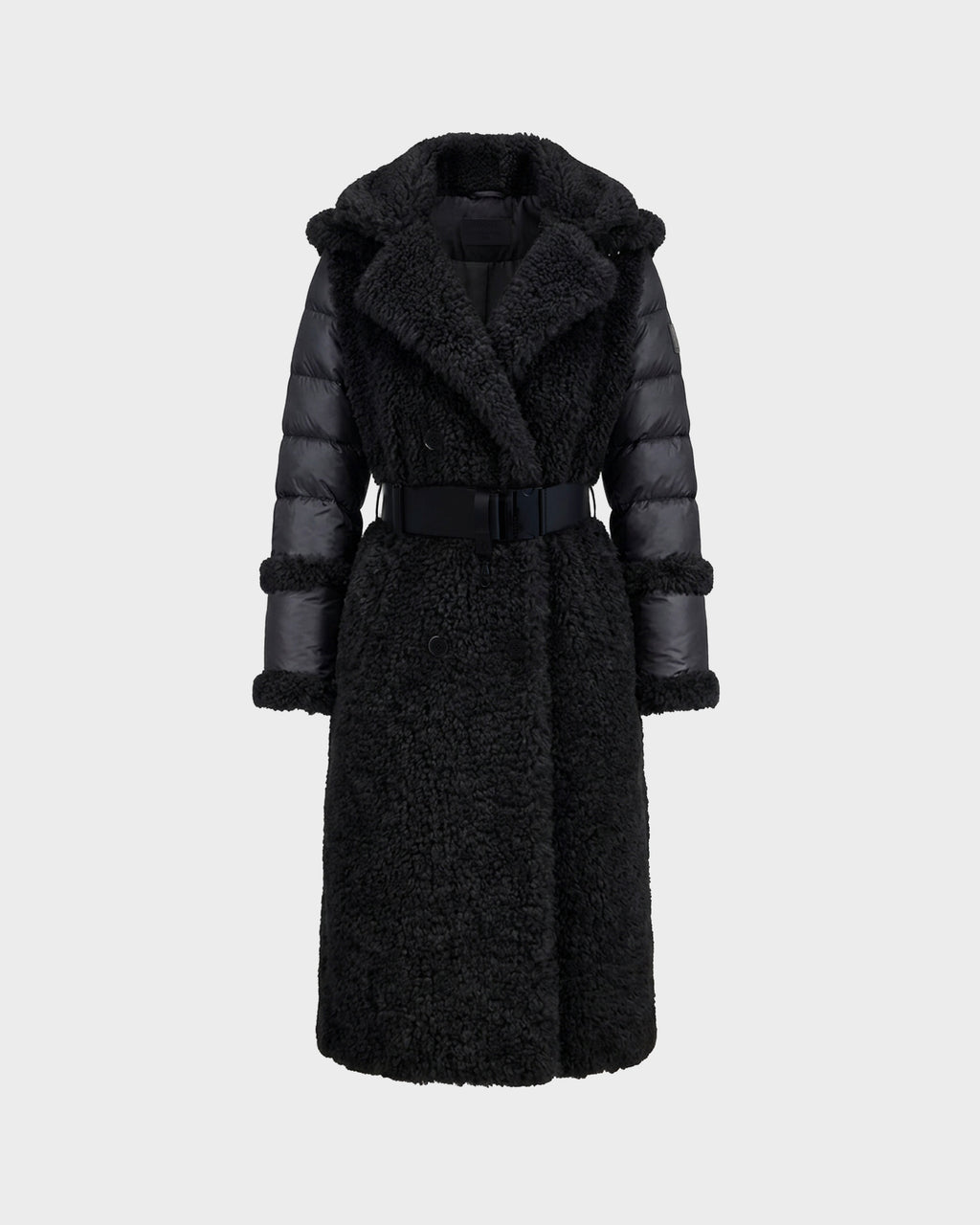The Rudsak NOELLE - 8126971 Black is a long black faux fur coat featuring a textured, fuzzy body, padded sleeves, a wide collar, and a matching belt at the waist. Displayed against a plain light gray background, this stylish women’s winter coat offers both warmth and elegance for the colder months.