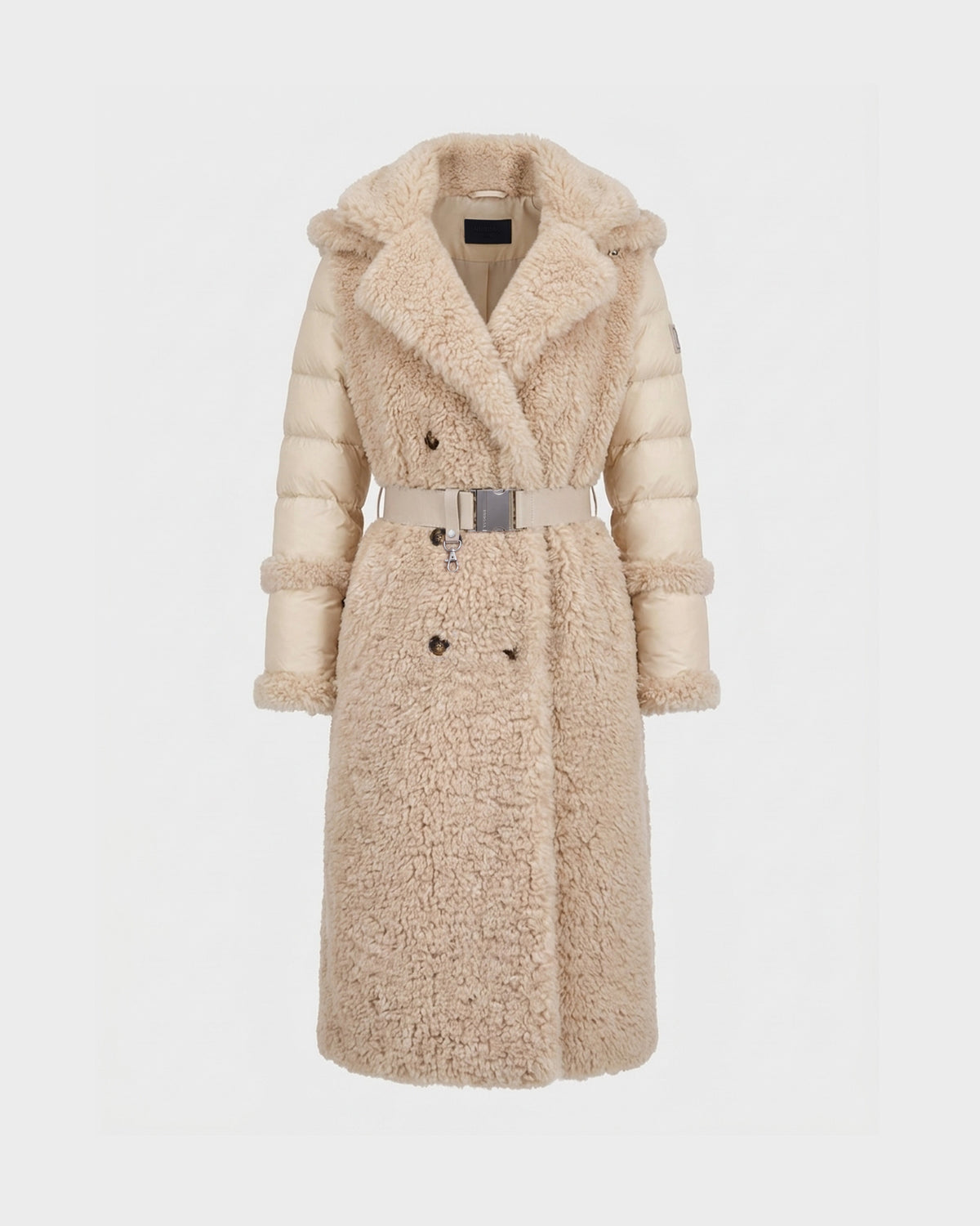 The NOELLE - 8126971 Cream by Rudsak is a long, beige winter coat featuring a plush faux fur front and collar, quilted sleeves resembling a classic down coat, a belted waist, and double-breasted button design, shown against a plain white background.