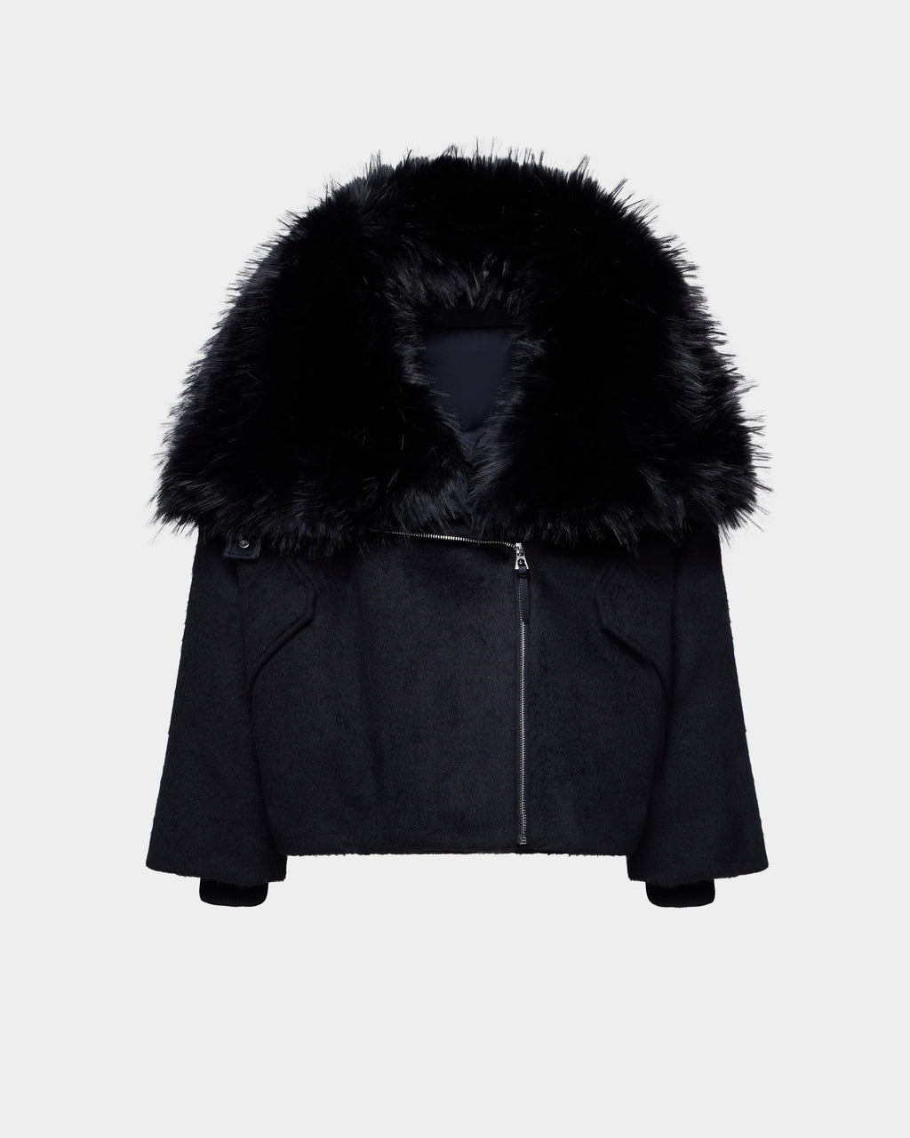 The Rudsak ZARIA - 8126999 Black features an oversized winter puffer design with long sleeves, an asymmetrical front zipper, and a removable faux-fur collar, shown on a plain white background.