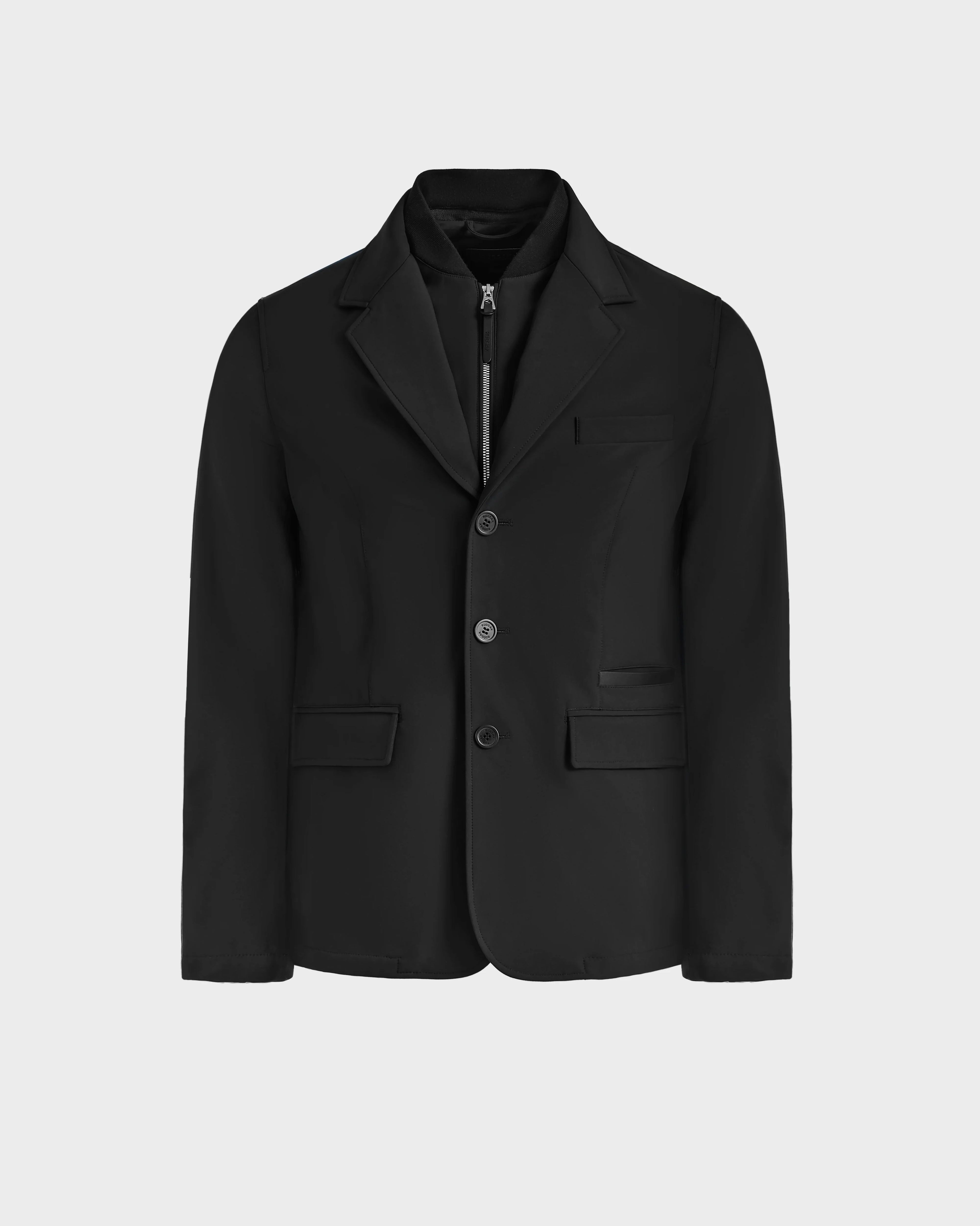 The KEITH - 6125045 Black blazer by Rudsak features notch lapels, three front buttons, two flap pockets, and a chest pocket, showcasing modern tailoring against a plain light gray background.