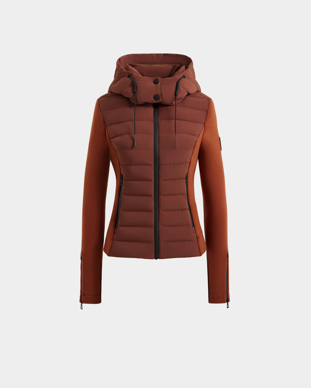 The Rudsak MABS - 8125055 Rust is a lightweight women’s activewear puffer jacket with a quilted front, smooth sleeves, hood, front zipper, and zippered pockets, shown on a plain white background.