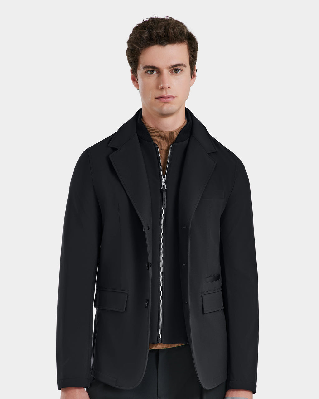 A man wears the KEITH - 6125045 Black blazer-style jacket by Rudsak, showcasing a must-have piece for the modern men’s wardrobe.